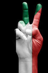 and making victory sign, Sudan painted with flag as symbol of victory, win, success - isolated on black background