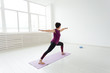 © satura_ - Yoga, people concept - a middle-aged woman doing a yoga and try to do a asana