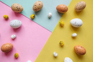 Wall Mural - Set of colored eggs on a colorful background. Festive Easter background. In the middle there is a place for text.