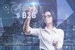 © photon_photo - The concept of business, technology, the Internet and the network. A young entrepreneur working on a virtual screen of the future and sees the inscription: B2B