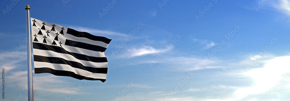 Drapeau du Bretagne se levant dans le vent avec le ciel en arrière-plan - obrazy, fototapety, plakaty 