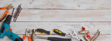 Top View Of Set Of Hand Tools On Wooden Background With Copy Space, Suitable For Header Or Banner