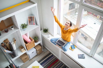 Poster - Happy young grateful businesswoman with laptop stretching her arms up while expressing triumph