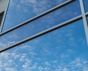 Modern building with glass walls with a sky in the background