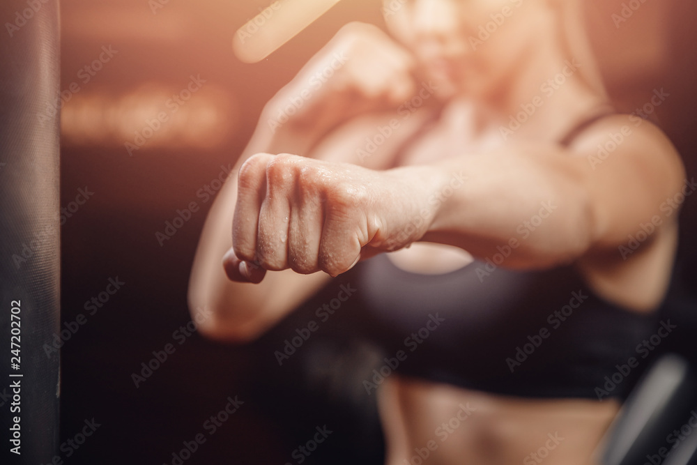 Fist fighter girl, concept of will to win. Self defense training - obrazy, fototapety, plakaty 