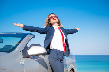 Poster - Successful young businesswoman on a beach