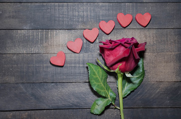 red rose on wood