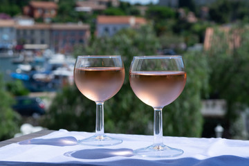 Rose wine of Provence, France, served cold on outdoor terrace in two wine glasses