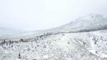 Papier Peint - Aerial view of rural mountain road in the Winter.