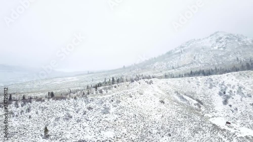 Fototapete - Aerial view of rural mountain road in the Winter.