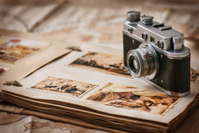 Photo Album With A Camera On The Background Of Old Vintage Maps