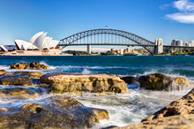 Sydney Harbour View With Opera House, Bridge And Rocks In The Foreground