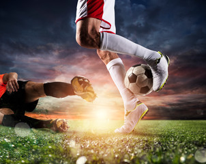 Soccer players with soccerball at the stadium during the match