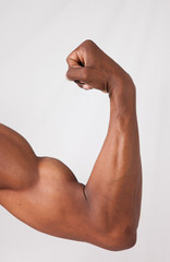 Strong Black man flexing muscles