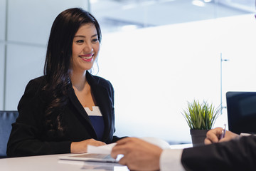 Wall Mural - Asian woman answering question interview during job application.