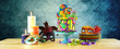 canvas print picture - Mardi Gras theme on-trend candyland fantasy drip cake on colorful party table setting.