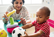 © Rawpixel.com - Nursery child playing with teacher in the classroom