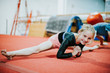 © Rawpixel.com - Young gymnast stretching her body