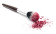 Professional makeup brush and colourful eye shadows isolated