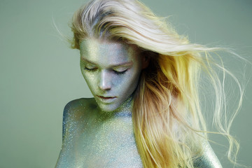 bright iridescent girl. Beautiful Young Woman with Sparkles