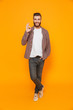 © Drobot Dean - Full length portrait of a cheerful young man