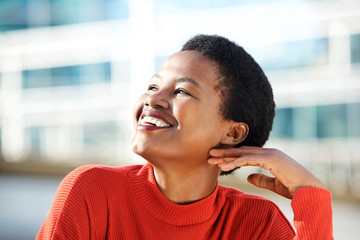 Close up beautiful young african american woman smiling and looking away