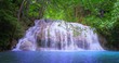 Scenic waterfall in tropical forest. Amazing nature background