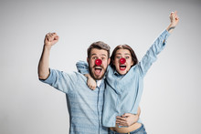 The Happy Surprised And Smiling Man And Woman On Red Nose Day. The Clown, Fun, Party, Celebration, Funny, Joy, Holiday, Humor Concept