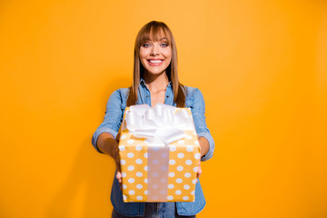 Poster - Portrait of her she nice cute sweet lovely winsome attractive cheerful straight-haired lady holding in hands giving you cool package isolated over bright vivid shine yellow background