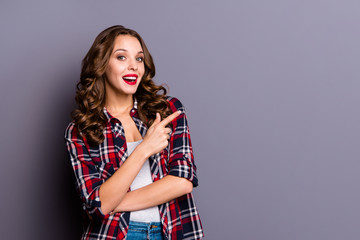 Portrait of nice-looking cute attractive lovely charming pretty cheerful cheery glad ecstatic wavy-haired lady pointing aside presentation isolated over gray pastel purple background