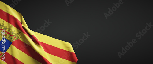 Fotografía Bandera de Aragónde tela sobre fondo oscuro