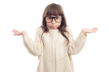 Wall Mural - Surprised child. Girl in glasses with a surprised facial expression, standing on a white background.