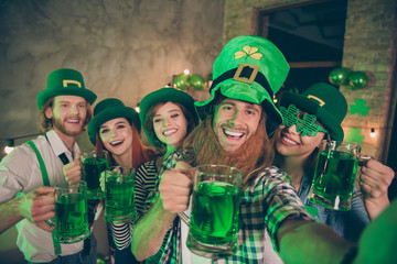 Poster - Group buddies arms raise beverage wear specs eyewear eyeglasses national culture costumes tradition hats checkered plaid jeans shirts lucky leaf false beard laugh laughter make take selfies