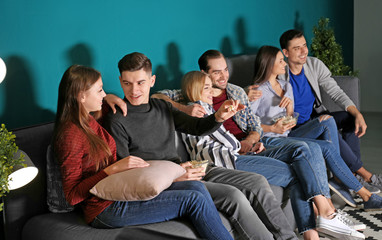 Poster - Young people watching movie in home cinema at night