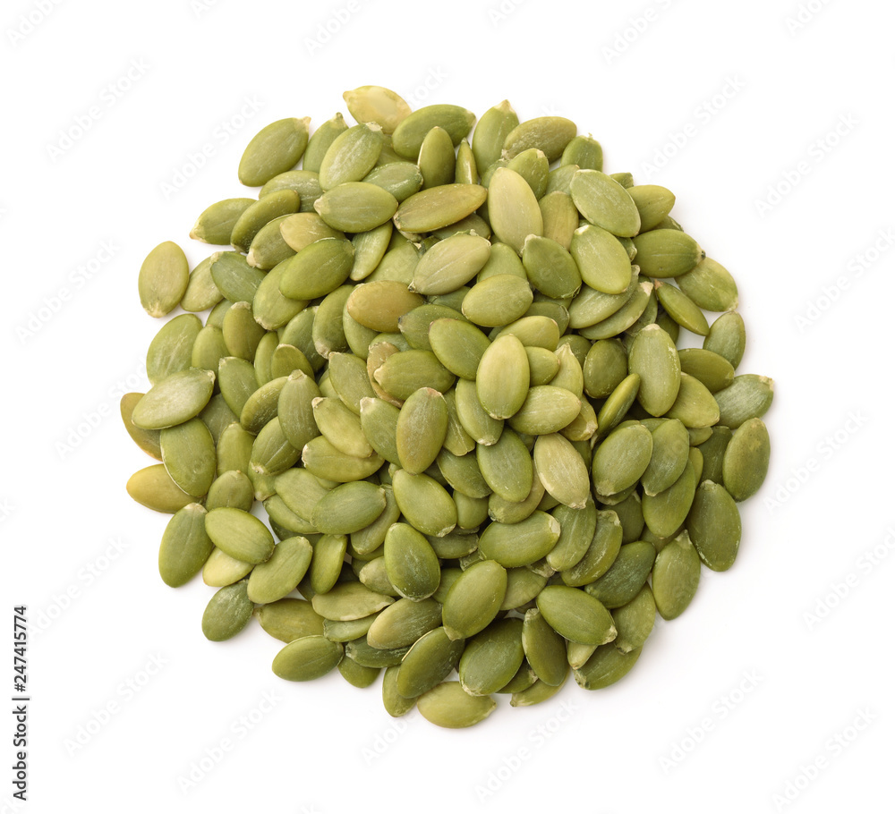 Top view of  shelled pumpkin seeds - obrazy, fototapety, plakaty 