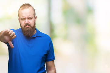 Sticker - Young caucasian hipster man wearing blue shirt over isolated background looking unhappy and angry showing rejection and negative with thumbs down gesture. Bad expression.