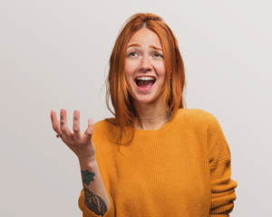 Wall Mural - portrait of a pretty redhead girl excited