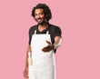 © Asier - Handsome african american baker reaching out to greet someone or gesturing to help, happy and excited