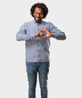 © Asier - Handsome business african american man making a heart with hands, expressing the concept of love and friendship, happy and smiling