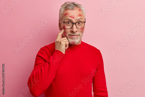 Surprised Handsome Grey Haired Man With Thick Stubble Points At