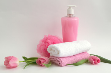 Liquid soap and two towels on a white background.