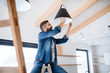 © Halfpoint - A mature man furnishing new house, a new home concept.