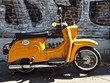 Oldtimer motor scooter of the historic DDR, Germany, in front of a wall
