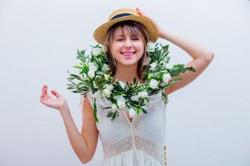 Beautiful woman with white roses wreath on white background. Springtime concept or Valentines Day holiday