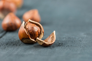 Hazelnuts, filbert on wooden table. heap or stack of hazel nuts. Hazelnut background, healty food