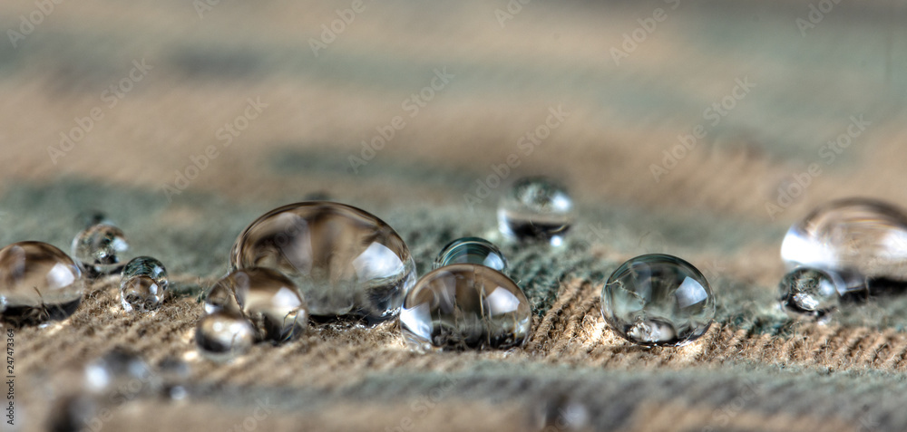 Water droplets on moisture resistant fabric Close up - obrazy, fototapety, plakaty 