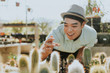 © Rawpixel.com - Cheerful man buying a cactus