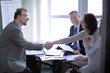 © yurolaitsalbert - handshake business women and business men near the desktop