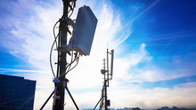 Silhouette Of 5G Smart Cellular Network Antenna Base Station On The Telecommunication Mast