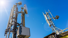 5G Smart Mobile Telephone Radio Network Antenna Base Station On The Telecommunication Mast Radiating Signal 